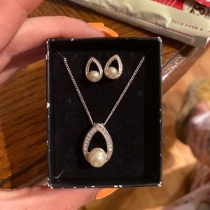 Pearl earrings and pendant necklace.